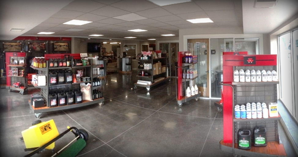 Parts showroom floor with shelves of oils, fluids, and supplies